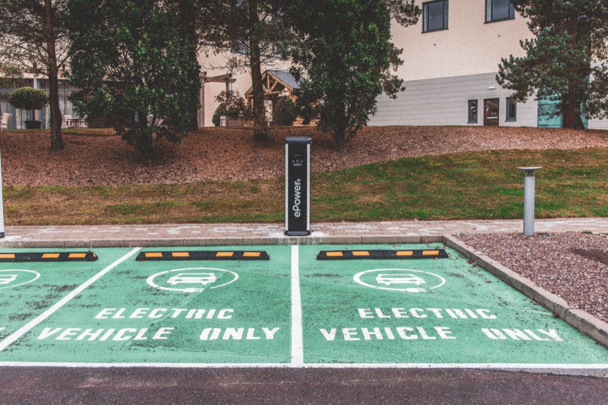 Modern electric car charging in a natural setting