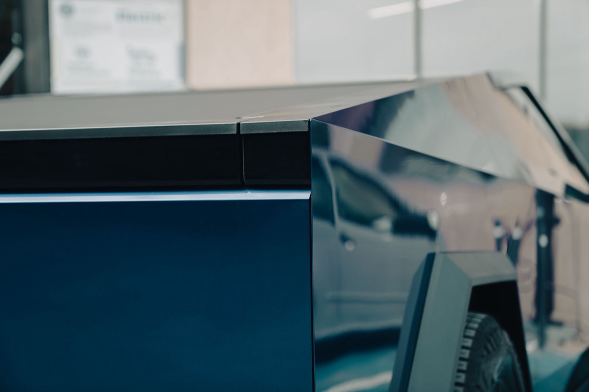 The futuristic design of a Tesla Cybertruck